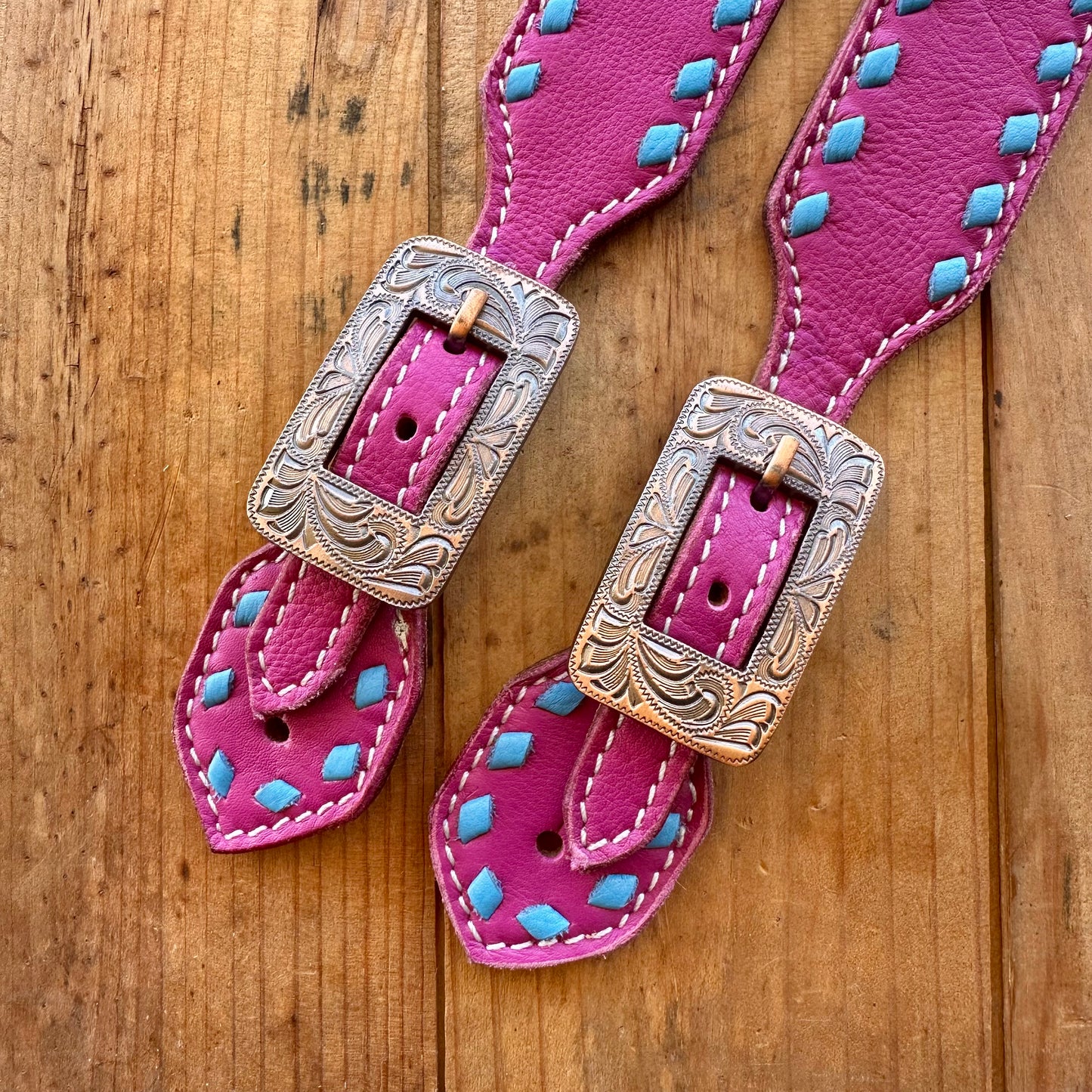 Pink Leather Spur Straps With Turquoise Buckstitch
